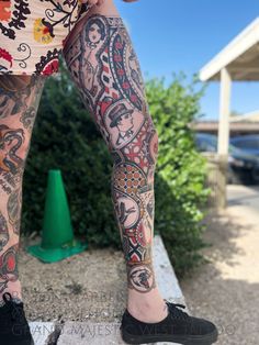 a person with tattoos on their legs and leg