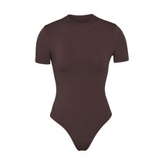 Essential T-shirt Bodysuit | Espresso — A versatile wardrobe foundation that offers light level of compression and smoothing. This bodysuit is made to wear alone or under clothing as the perfect base layer. High Stretch Solid Color Smoothing Leotard, High Stretch Smoothing Solid Color Leotard, High Stretch Solid Leotard With Smoothing, Seamless Leotard With Minimal Stretch, Solid Color Smoothing Shapewear Bodysuit, Sleek Compressive Seamless Bodysuit, Compression Shapewear Bodysuit, Solid Bodysuit With Seamless Compression, Solid Color Compression Bodysuit With Seamless Detail