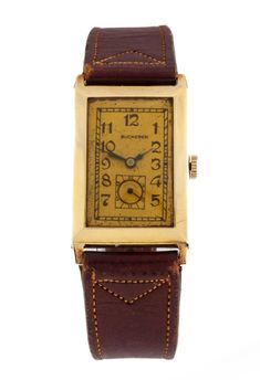 Bucherer 14k Gold Antique Art Deco Rectangular Hand-Winding Wrist Watch Mvmt 500 Model #3310 Movement #500 14k Yellow Gold Rectangular Case 23 mm Wide (24 mm w/ Crown) 32 mm Long Lug-to-Lug Distance = 38 mm Lug-to-Lug Width = 18 mm Thickness = 7 mm Mustard Dial w/ Black Arabic Art Deco Numbers and Chapter Ring NOTE: Dial is slightly askew but still working condition Cobalt Blue Hands w/ Seconds Subdial 17 mm Wide 26 mm Long Brown Leather Band w/ Gold-Plated Clasp Original 18k Yellow Gold Clasp Included Total Length = 9" Largest Wrist Fit = 8" Width at Case = 19 mm Width at Tip = 16 mm Total Mass = 18.4 grams Does Not Include Original Box or Papers Free US Shipping with Insurance Included. All items are professionally packaged and shipped. All shipments include insurance and delivery confir Antique Watch With Rectangular Dial And Chronometer, Antique Watch With Chronometer And Rectangular Dial, Antique Watches With Chronometer And Rectangular Dial, Antique Chronometer Watch With Rectangular Dial, Vintage Yellow Gold Rectangular Watch Band, Gold Rectangular Chronometer Watch, Rectangular Yellow Gold Watch With Subdials, Rectangular Yellow Gold Watches With Subdials, Vintage Yellow Gold Rectangular Watch