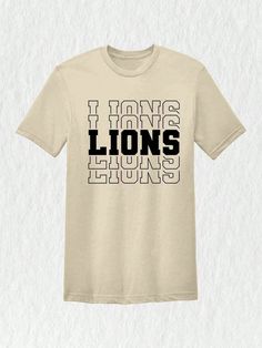 Introducing our latest addition to the winning lineup - the Lions Team Mascot Shirt!  Embrace your fierce school spirit and show off your pride with this Lions-themed tee that perfectly captures the essence of your favorite team. Crafted with utmost care and dedication, this Lions Mascot Shirt is designed to unite fans and players alike.  Its vibrant colors and bold lion mascot print make it a standout choice for all supporters. The striking combination of the team name and the mascot beautifull Team Spirit Shirts, Halloween Letras, Lion Mascot, Mascot Shirt, Team Mascots, Spirit Shirts, Team Shirt, Geometric Graphic, Fan Shirts