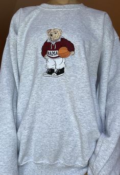 Introducing our embroidered Alabama bear sweatshirts - a perfect blend of comfort and style. Each made-to-order sweatshirt comes with a durable embroidery backing, ensuring it holds up even after multiple washes. Unlike printed designs, the embroidered touch offers longevity and stands the test of time. The materials matter, and we take pride in using high-quality threads paired with Gildan fleece crewnecks - a 50% cotton and 50% polyester blend. The result? A comfy and durable sweatshirt that m Auburn Sweatshirt, Embroidery Backing, Alabama Sweatshirt, Custom Teddy Bear, Bear Sweatshirt, College Sweatshirt, Vintage Crewneck, Sweatshirt Vintage, Vintage Sweatshirt