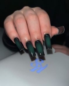 For a more dramatic look, the dark green gradient is a perfect choice. This design transitions from a deep, almost black green at the cuticle to a lighter shade at the tips, creating a mysterious and captivating effect. The glossy finish adds an extra layer of sophistication, making these nails perfect for any fall occasion.   Photo credit by: @nailzdonebydreaa Nails Acrylic Fall Green, Coffin Acrylic Nails Dark Colors, Square Acrylic Nails Dark Colors, Medium Length Nails Acrylic Designs, Dark Green Nails Acrylic Coffin, Dark Gel X Nails, Dark Colors Nails, Ballerina Fall Nails, Green And Black French Tip Nails