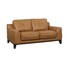 a brown leather couch sitting on top of a white floor