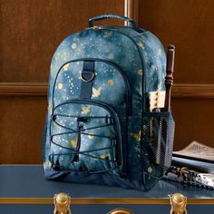 Gear up for school days and adventures of all kinds with our top-quality backpacks. Made of water-resistant polyester crafted from recycled plastic bottles, this roomy accessory allows you to take your laptop, books and more wherever you go. Intricately designed with golden owls and stars, this look provides you with the most enchanting backpack around. DETAILS YOU'LL APPRECIATE Shell is made of rugged, water-resistant 600-denier, 100% recycled polyester. The large backpack features 4 roomy exte Harry Potter Backpack, Enchanted Night, Teen's Backpack, School Must Haves, Kids School Backpack, Harry Potter Costume, Harry Potter Art, Blue Backpack, Llbean Backpack