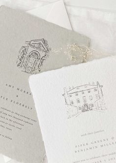 the wedding stationery is laid out on top of each other, including an envelope