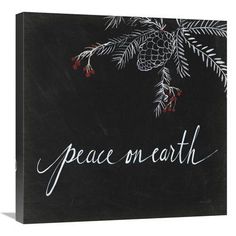 a chalkboard with the words peace on earth written in white lettering and pine cones