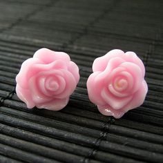 Silver tone post earrings (no nickel) are combined with pretty handmade resin roses in a soft shade of blush pink. The pair also comes with a matching set of silver tone earring backs.Size: 14mm rosesThese earrings are available in a variety of colors! http://etsy.me/1rv1YFVThey are also available as dangle earrings!Bronze - https://www.etsy.com/stumblingonsainthood/listing/106361809Silver - https://www.etsy.com/stumblingonsainthood/listing/113486696If you would like to order a larger quantity t Pink Rose Flower Earrings For Gift, Pink Flower Earrings With Rose Design, Pink Rose Earrings, Earrings Flower, Flower Jewelry, Earrings Stud, Rose Earrings, Flower Jewellery, Handmade Design