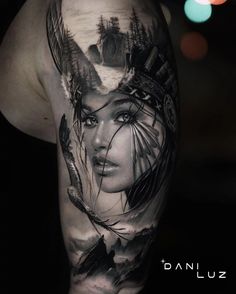 a woman's face with trees and mountains in the background on this half sleeve tattoo