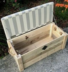 an empty wooden box sitting on the ground