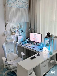 a white desk with two computer monitors and a chair in front of the monitor screen