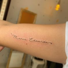 a person with a tattoo on their arm that reads, miss edwards in cursive writing