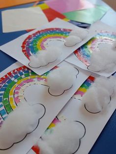 paper plates with clouds and rainbows on them