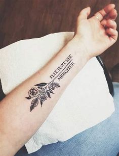 a woman's arm with a tattoo on it that says, education is strength