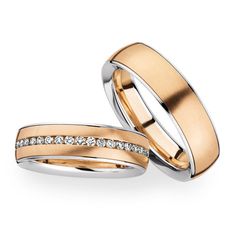 two gold wedding bands with diamonds