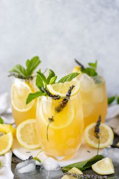 two glasses filled with lemonade and mint garnish