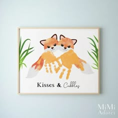 two foxes are holding hands with the words kisses and cuddle