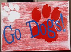 a hand painted sign that says go dogs