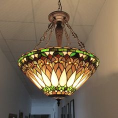 a stained glass light hanging from the ceiling