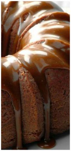 a bundt cake with caramel drizzled on it's top