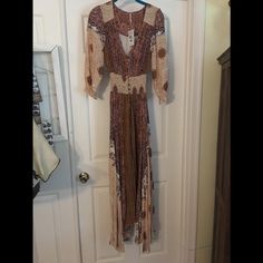 Light Weight Flowing Dress Brown V-neck Boho Dress For Fall, Brown Fitted Maxi Length Dress, Long Sleeve Brown Bohemian Boho Dress, Brown Long Sleeve Boho Dress For The Beach, Fall Boho Print Maxi Dress, Long Fall Dress With Boho Print, Brown Long Sleeve Boho Dress, Long Sleeve Brown Boho Dress For The Beach, Long Boho Print Dress For Fall