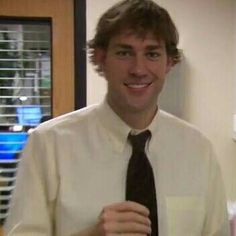 a man wearing a white shirt and black tie