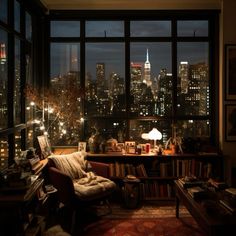 a living room filled with lots of furniture and tall buildings in the background at night