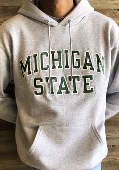 Champion Michigan State Spartans Mens Grey Arch Twill Long Sleeve Hoodie - 14750464 Gray Casual Hoodie For Fans, Casual Gray Hoodie For Fans, Cotton Hoodie For Game Day In Fall, Cotton Hoodie In Athletic Heather For College, Casual Team Name Hoodie For Fall, Team Spirit Hoodie For College In Winter, Fall Fan Gear Hoodie With Letter Print, Varsity Hoodie For Game Day In Fall, Sports Fan Letter Print Hoodie For Fall