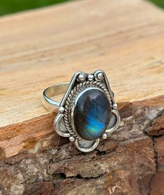 Unveil the mystical allure of our handcrafted Labradorite Ring, a beauty showcasing the iridescent magic of labradorite. Set in sterling silver, each natural labradorite stone is chosen for its unique hues. Known as black moonstone the healing gemstone makes every ring a one-of-a-kind treasure. Perfect for those who adore bohemian elegance or seek the meaningful, mystical charm of handmade jewellery. ➵ Metal: Solid 925 Sterling Silver ➵ US Ring Size: Choose Size ➵ Gemstone: Labradorite (Black Moonstone) ➵ Style: Vintage, Bohemian, Cabochon ➵ Packaging: Sustainable Box (Letterbox) To all the wonderful humans that support my small business... THANK YOU ❤️    **         DELIVERY         ** UK  ➵ 1st Class Signed For - £3.45 (1-2 business days) EU ➵ International Tracked and Signed  - £8.65 (1 Mystical Cabochon Rings As A Gift, Bohemian Cabochon Moonstone Ring, Bohemian Round Cabochon Moonstone Ring, Bohemian Oval Cabochon Moonstone Ring, Bohemian Moonstone Cabochon Crystal Ring, Bohemian Moonstone Crystal Ring With Cabochon, Bohemian Moonstone Cabochon Ring, Bohemian Moonstone Ring With Large Stone For Gift, Bohemian Moonstone Ring With Large Stone As Gift