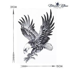 an eagle tattoo design on the back of a white shirt with black and grey wings