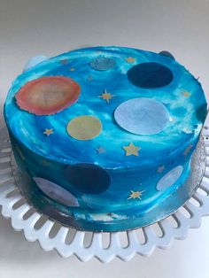 a cake with blue icing and stars on it