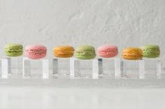 a row of different colored macaroons sitting on top of each other