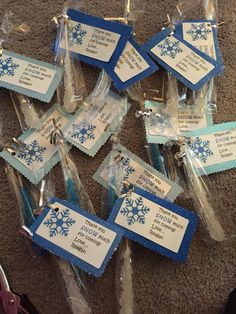 several snowflake tags are wrapped in clear cellophane