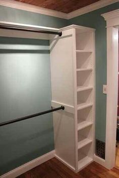 an empty closet with shelves and sliding glass doors on the door is seen in this image