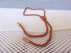 Vintage Southwestern bolo tie. Hickock USA The slide measures approx. 1-1/8 inch long x 15/16 of an inch wide. Leather or faux leather slide. Brown fabric cord with gold tone aglets. Unisex. Signed Hickock USA Bola. Add it to your collection. Pre owned in good condition. All sales are final and as is. Thank you for looking. You may also love this: https://www.etsy.com/listing/581016725/vintage-sunstone-bolo-tie-southwestern?ga_search_query=bolo%2Btie&ref=shop_items_search_2&pro=1 Fabric Cord, Masquerade Costumes, Tie Men's, Southwestern Style, Brown Fabric, Leather Slides, Western Fashion, Gold Tones