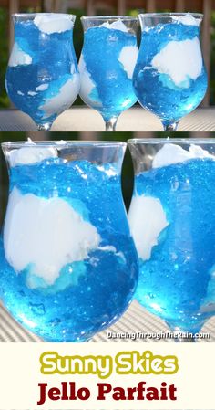 three glasses filled with blue liquid and white clouds in them, sitting on top of a table