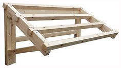 a wooden bed frame sitting on top of a white floor