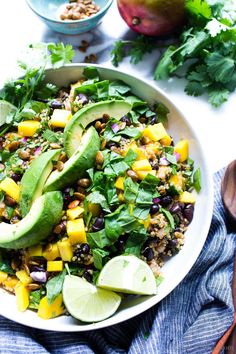 a salad with mangoes, avocado and other ingredients