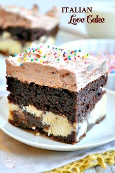 a piece of cake with chocolate frosting and sprinkles on a plate