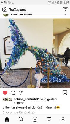 a woman sitting on top of a bench covered in blue and green feathers with the caption instagram