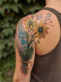 a man with a flower tattoo on his arm