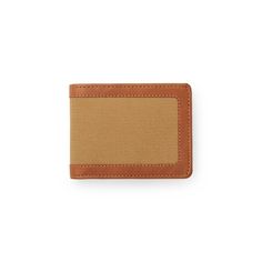 A new take on an old favorite – our Outfitter Wallet is made of proprietary Weatherproof Leather and Rugged Twill. Heavy-duty nylon thread holds up to years of daily use. | Filson Rugged Twill Outfitter Wallet Tan Durable Bifold Wallet For Everyday Use, Beige Rfid Blocking Bifold Wallet, Casual Beige Travel Wallet, Casual Beige Wallets, Everyday Beige Bifold Wallet, Filson Bags, Fold Wallet, Bifold Wallet, The Outdoors