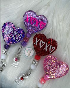 These adorable XOXO Heart Badge reels are good for any profession when needing a reel. These are perfect to show your Valentines Day spirit. The finished project is coated in Uv Resin to protect it. The badge reel itself is specialist id brand with alligator swivel or belt/slide clip which is glued with e6000 to the blank to ensure it won't fall off. *Colors may slightly look different in person depending on screen resolution. If you have any questions please reach out to the shop. CARE: Acrylic Valentines Badge Reel Ideas, Heart Badge Reel, Custom Badge Reel, Shaker Badge Reels, Resin Badge Reel Ideas, Badge Reels Diy Ideas, Resin Badge Reel Diy, Resin Badges