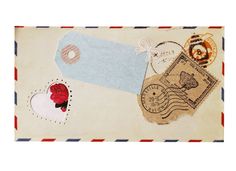 an envelope with stamps and hearts on it