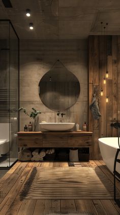 a bathroom with wooden floors and a round mirror