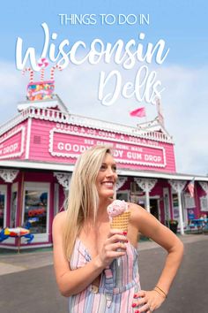 a woman holding an ice cream cone in front of a pink building with the words things to do in wisconsin dellk