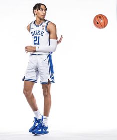 a basketball player is posing for a photo