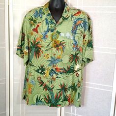 Classic Hawaiian Shirt With Front Pocket. Perfectly Matched Print Of Hula Dancers, Palms, Parrots. Like New, Never Worn. Two Extra Buttons Of Coconut Shell. 26" Pit To Pit, 29" Back Of Neck To Hem. 5 Green Hawaiian Shirt With Floral Print And Relaxed Fit, Hawaiian Printed Relaxed Fit Shirt, Green Collared Beach Tops, Green Hawaiian Shirt With Camp Collar, Green Printed Short Sleeve Collared Shirt, Green Printed Collared Short Sleeve Shirt, Green Hawaiian Short Sleeve Shirt With Print, Hawaiian Collared Tops With Graphic Print, Hawaiian Collared Top With Graphic Print