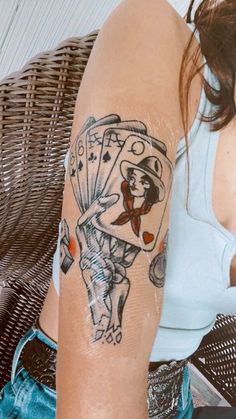 a woman with a tattoo on her arm