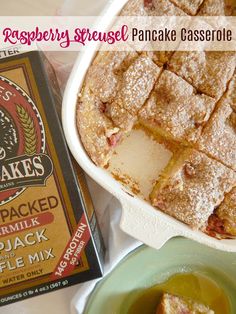 a pancake casserole with powdered sugar on top and a box of cake mix next to it