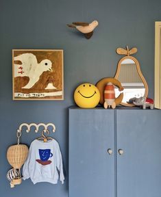 a blue cabinet with some toys on top of it